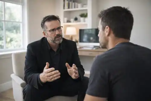 Gary Voysey counselling a younger man in a bright home office